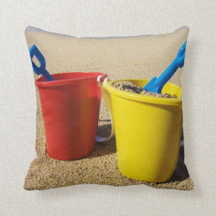 Shovels And Pails On Sandy Beach Cushion