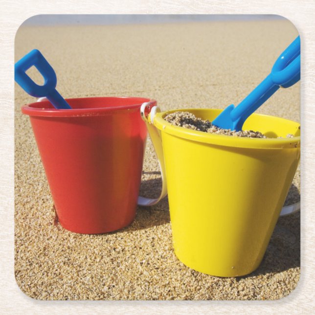 Shovels And Pails On Sandy Beach Square Paper Coaster (Front)