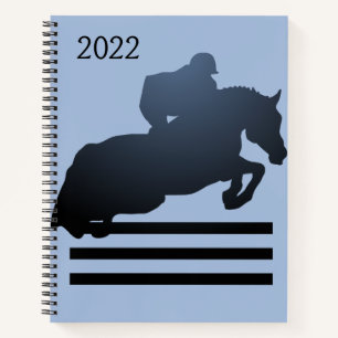 Show jumper clearing an obstacle notebook