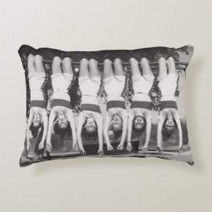 Showgirls on monkey bars, playful design. decorative cushion