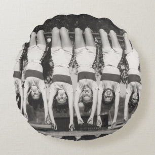 Showgirls on monkey bars, playful design. round cushion