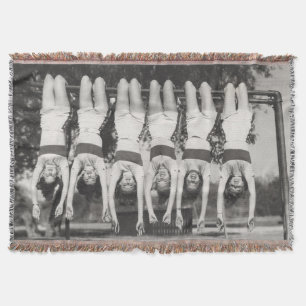 Showgirls on monkey bars, playful design. throw blanket