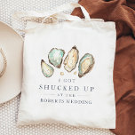 Shucked Up | Coastal Oyster Wedding Favour Tote Bag<br><div class="desc">These cheeky wedding favour tote bags feature a group of soft cream and aqua watercolor oyster and pearl illustrations, with "I got shucked up at the [name] wedding" in classic navy blue lettering. A perfect punny choice for beach themed, summer, or nautical weddings, you can easily personalise these coastal wedding...</div>