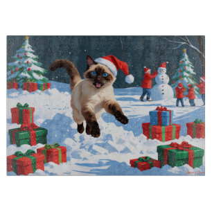 Siamese Cat Running in Snow with Christmas Hat Cutting Board