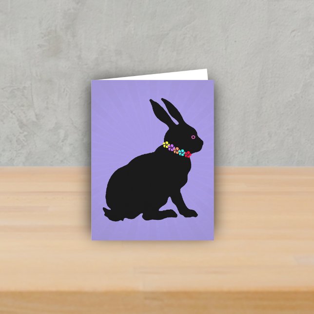 Side Profile sitting Black Rabbit Flowers Pink Eye Card (Black sitting silhouette bunny wearing colourful flowers on purple spring or Easter note card.)