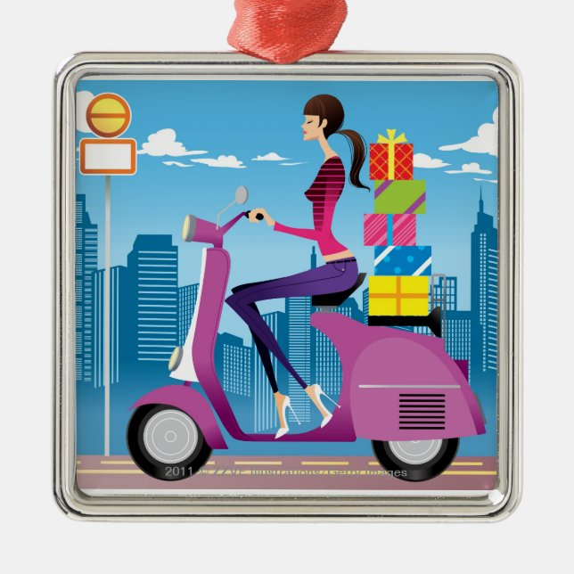 Side view of woman with gifts on scooter metal tree decoration (Front)