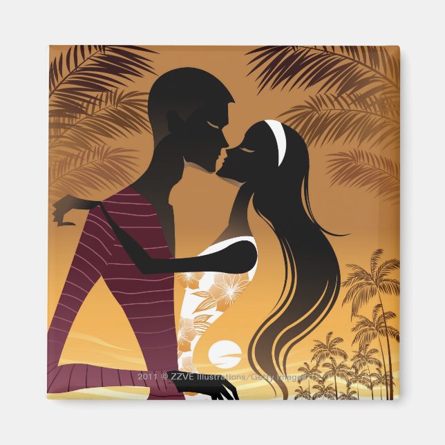 Side view of young couple standing in beach magnet (Front)