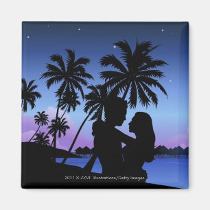 Silhouette of a couple embracing on the beach magnet