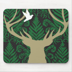 Silhouette of a deer, a dove and a star against a mouse pad