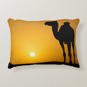 Silhouette of a wild camel at sunset decorative cushion