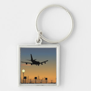 Silhouette of an aeroplane in flight key ring