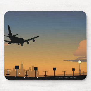 Silhouette of an aeroplane in flight mouse pad