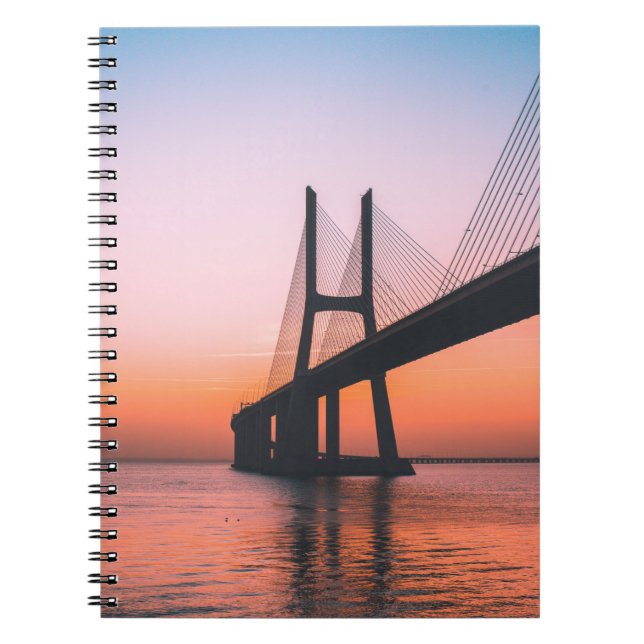 SILHOUETTE OF BRIDGE UNDER CLEAR SKY NOTEBOOK (Front)