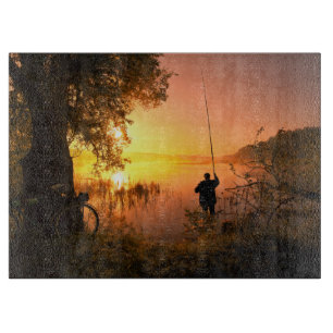 Silhouette of Fisherman on Lake at Sunset Cutting Board
