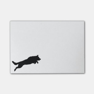 Silhouette of German Shepherd Dog Jumping over Post-it Notes