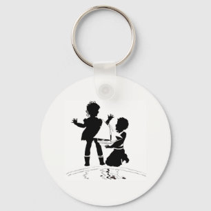 silhouette of girl and boy and model boat key ring