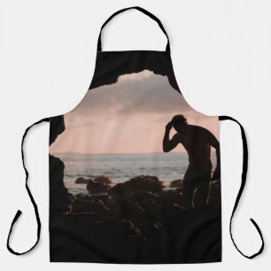 Silhouette of man in cave apron