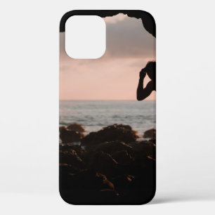 Silhouette of man in cave iPhone 12 case
