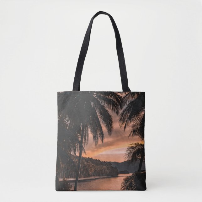 Silhouette of palm tree during golden hour tote bag (Front)