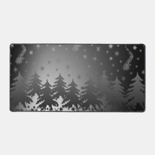 Silhouette spruces in the glow of Christmas stars Desk Mat