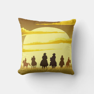 Silhouetted cowboys, sunset galloping team. cushion