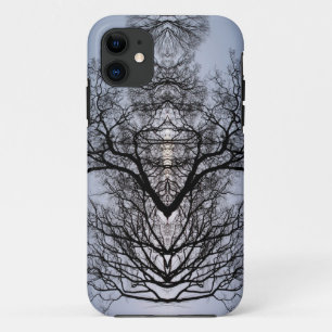 Silhouetted tree pattern and blue sky iPhone 11 case