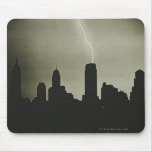Silhouettes of skyscrapers and lightning in sky mouse pad
