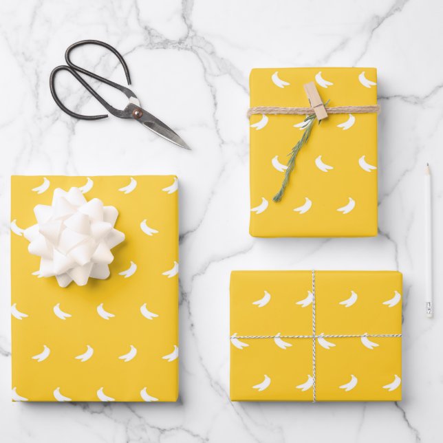 Silhouettes of Small White Bananas on Yellow Wrapping Paper Sheet (Front)