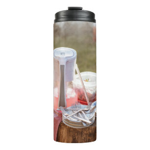Silver-and-blue floral ceramic plates and pitcher thermal tumbler