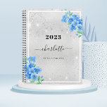 Silver blue floral name appointment 2025 planner<br><div class="desc">A faux silver looking background,  with blue forget-me-not florals,  flowers. Faux glitter dust. Personalise and add a year,  name and title.</div>