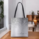 Silver Glitter Monogram Name Luxury Girly Tote Bag<br><div class="desc">Silver Faux Sparkle and Dripping Glitter Metallic Stainless Steel Foil Elegant Monogram Book Bag. This Book Bag can be customised to include your initial and first name and given as a gift for Christmas,  Sweet 16 Birthday,  Bridal Shower or a Wedding.</div>