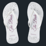 Silver Lace Cassis Purple The Bride White Wedding Jandals<br><div class="desc">Dance the night away with these beautiful wedding flip flops. Designed for the bride, they feature a simple yet elegant design with cassis purple, magenta, or berry coloured script lettering on a white background and fancy silver grey lace curls and swirls. Beautiful way to stay fancy and appropriate while giving...</div>