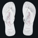 Silver Lace & Dusty Rose Script The Bride Wedding Jandals<br><div class="desc">Dance the night away with these beautiful wedding flip flops. Designed for the bride, they feature a simple yet elegant design with dusty rose or mauve pink script lettering on a white background and fancy silver grey lace curls and swirls. Beautiful way to stay fancy and appropriate while giving your...</div>