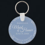 Silver Lace Maid of Honour Periwinkle Blue Wedding Key Ring<br><div class="desc">These beautiful keychains are designed to be given as a gift or wedding favour to your maid of honour. The elegant design features a frilly silver grey faux foil border with pale grey text on a dusty periwinkle blue background. There is space for her name, the wedding date and the...</div>