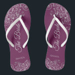 Silver Lace on Cassis Purple The Bride Wedding Jandals<br><div class="desc">Dance the night away with these beautiful wedding flip flops. Designed for the bride, they feature a simple yet elegant design with pale gray script lettering on a cassis purple, magenta, or berry colored background and fancy silver gray lace curls and swirls. Beautiful way to stay fancy and appropriate while...</div>