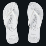 Silver Lace on White Elegant The Bride Wedding Jandals<br><div class="desc">Dance the night away with these beautiful wedding flip flops. Designed for the bride, they feature a simple yet elegant design with grey script lettering on a white background and fancy silver grey lace curls and swirls. Beautiful way to stay fancy and appropriate while giving your feet a break after...</div>