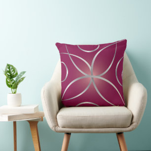 Silver on magenta cushion