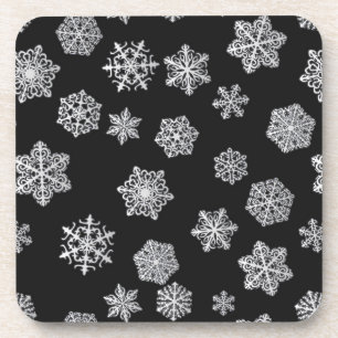 Silver snowflakes on a black background coaster