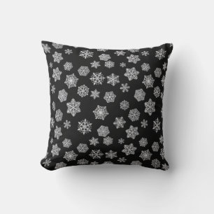 Silver snowflakes on a black background cushion