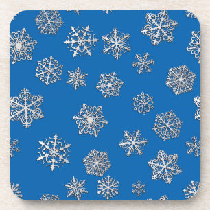 Silver snowflakes on a cobalt blue background coaster