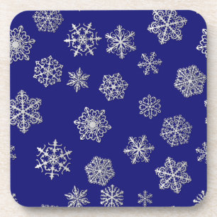 Silver snowflakes on a dark blue background coaster