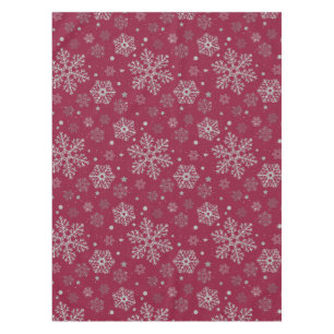 Silver snowflakes on dark red tablecloth