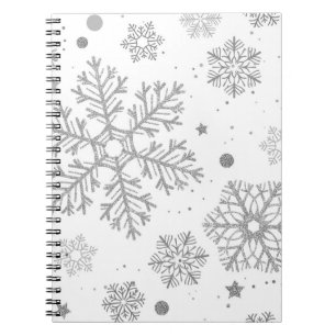 Silver snowflakes on white notebook