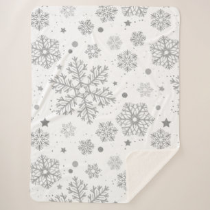 Silver snowflakes on white sherpa blanket