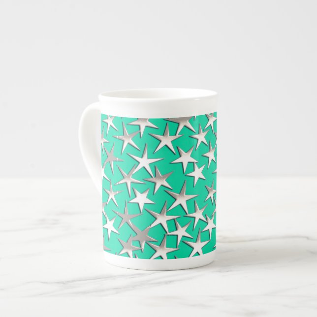 Silver stars on turquoise bone china mug (Front Left)