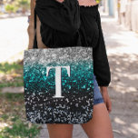 Silver Teal Black Gradient Chunky Glitter Monogram Tote Bag<br><div class="desc">A modern bold single letter double layer text monogram in white with a black drop shadow. The font size, colour and style are customisable. The background is a faux chunky glitter in a silver, teal and black ombre with sparkly and bokeh blur spots. Move or delete the faux sparkle graphic...</div>