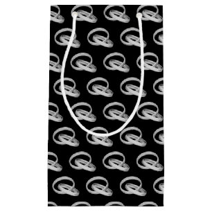 silver wedding bands connected small gift bag