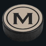 Simple Black Monogram Initial Hockey Puck<br><div class="desc">Minimal monogrammed design features a black and beige monogram medallion in a white classic block typography. Personalise with your initial.</div>
