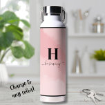 Simple Blush Pink Monogram Water Bottle<br><div class="desc">This chic water bottle features a blush pink background with a personalised initial and script calligraphy name elegantly displayed below. The soft, feminine design exudes a girly and modern vibe, making it a perfect accessory for her. Whether you're heading to the gym, yoga, the office, or just out and about,...</div>