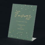 Simple Classic Christmas Wedding Favours Sign<br><div class="desc">This simple classic Christmas wedding favours sign features a clean, bright white backdrop with simple, minimalist black and gold lettering and handwritten calligraphy accents. Embellishments of beautiful and classic green and red Christmas wreaths with delicate gold features create a perfect winter holiday aesthetic while maintaining a polished elegance for your...</div>